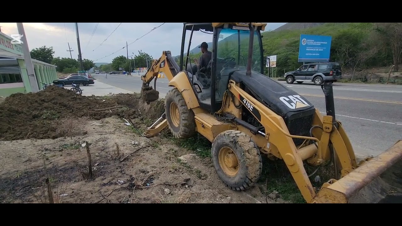 Caterpillar 416E Trabajo de limpieza de desague