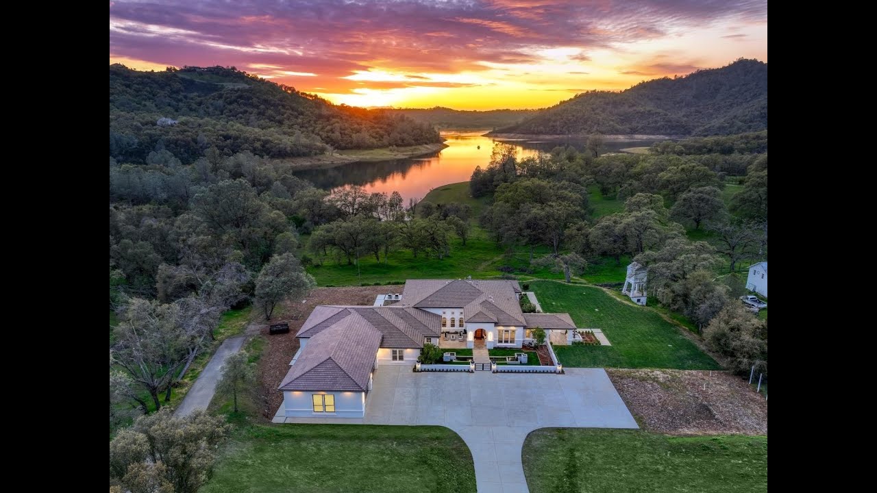 Unparalleled waterfront estate situated on expansive 3-acres, along Folsom Lake!