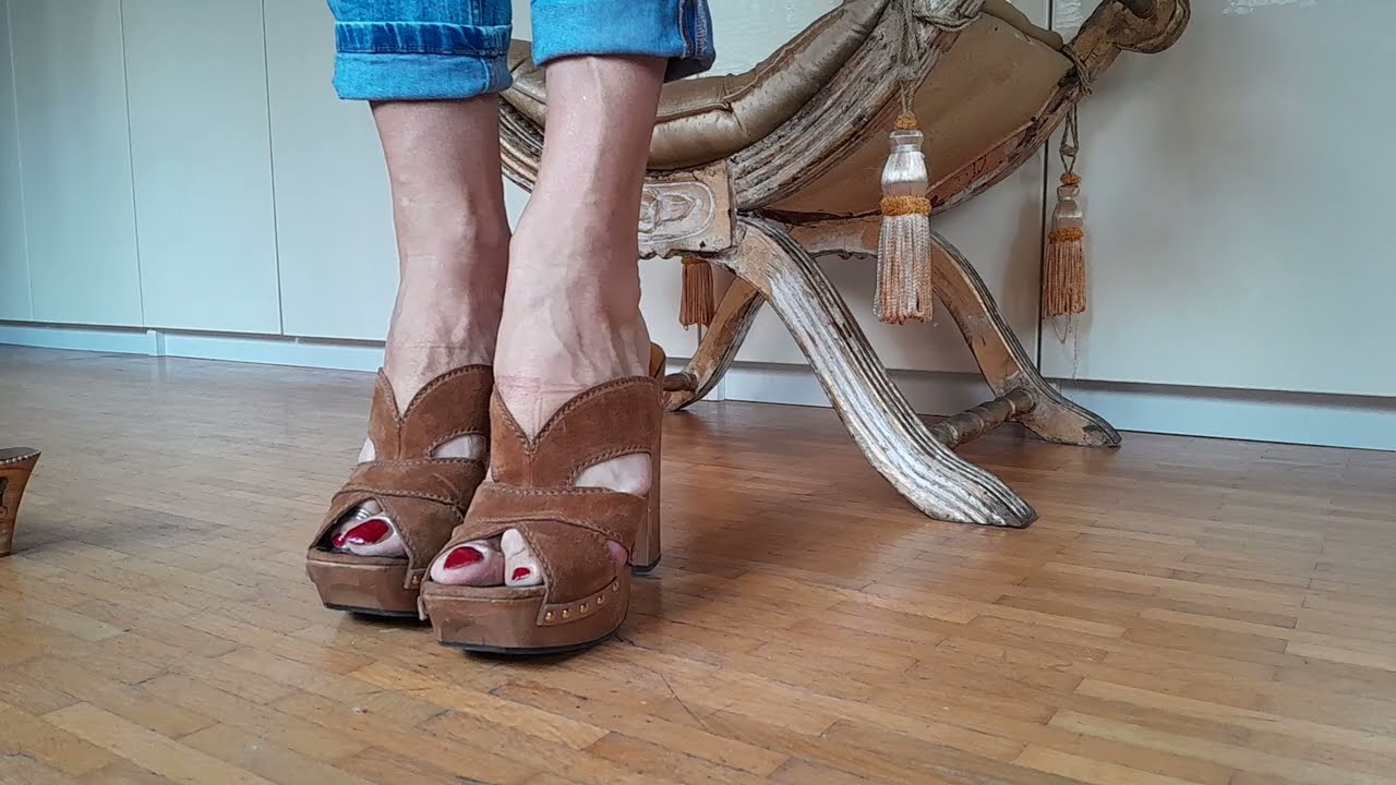 Barefoot in Miu Miu wooden clogs.