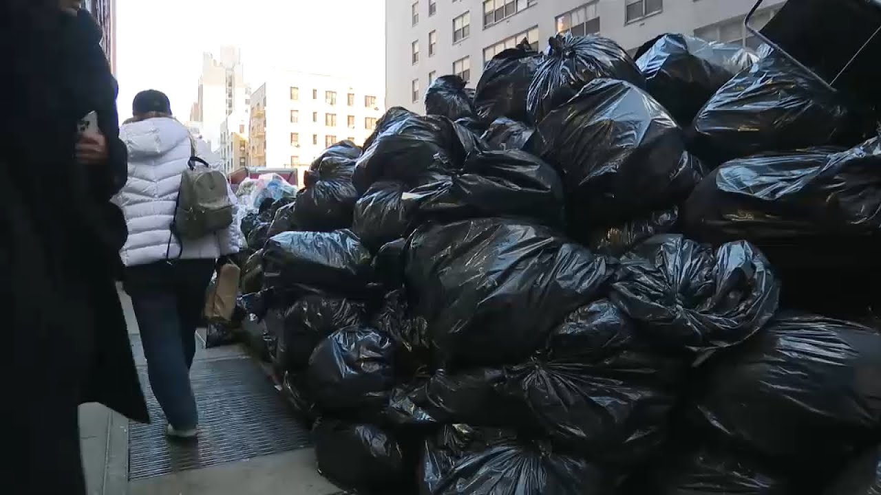 Trash piles up on snowbanks in parts of NYC
