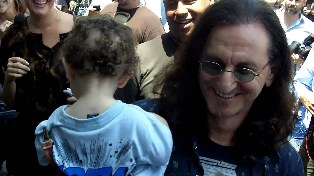 Geddy Lee signing autographs after getting star on Hollywood Walk of Fame