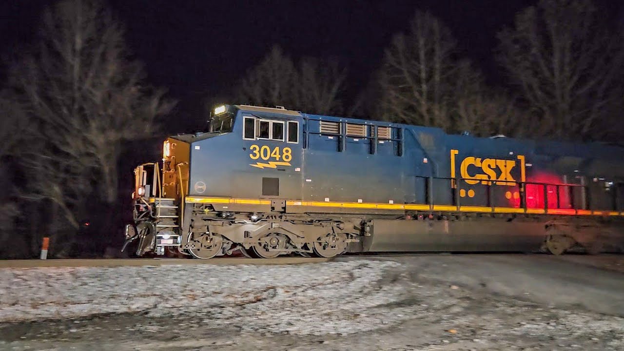 Pan Am, Maine Central rolling stock on CSX freight train: short chase!