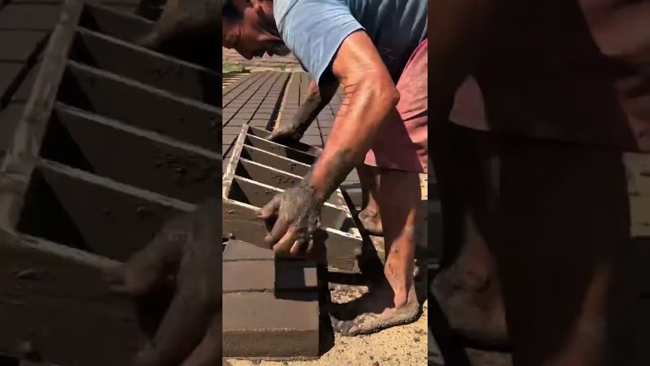 making handmade clay bricks by filling a wooden mold with mud and carefully lifting it off to dry