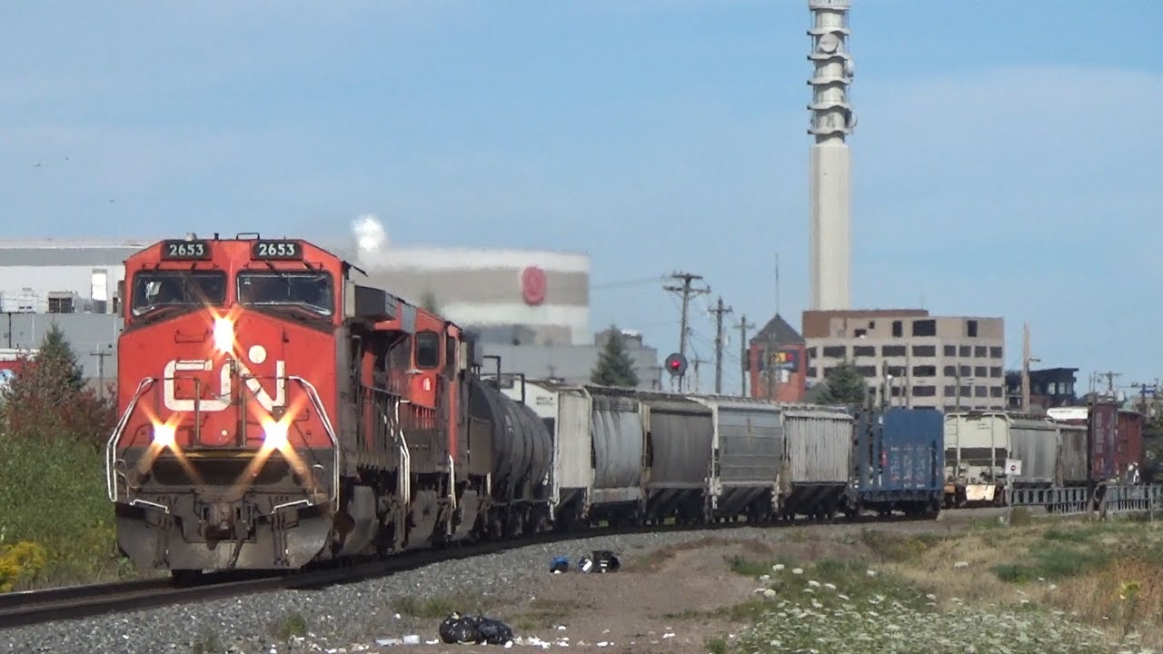 Three Engines Power a Decent Size Manifest Train CN 507 thru Moncton, NB