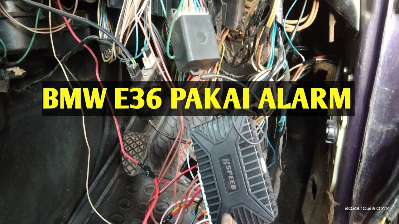memasang alarm di mobil BMW E36