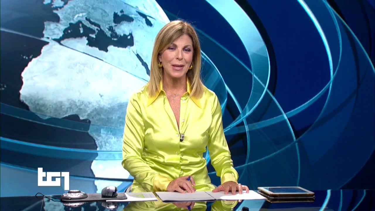 Sonia Sarno in yellow satin blouse