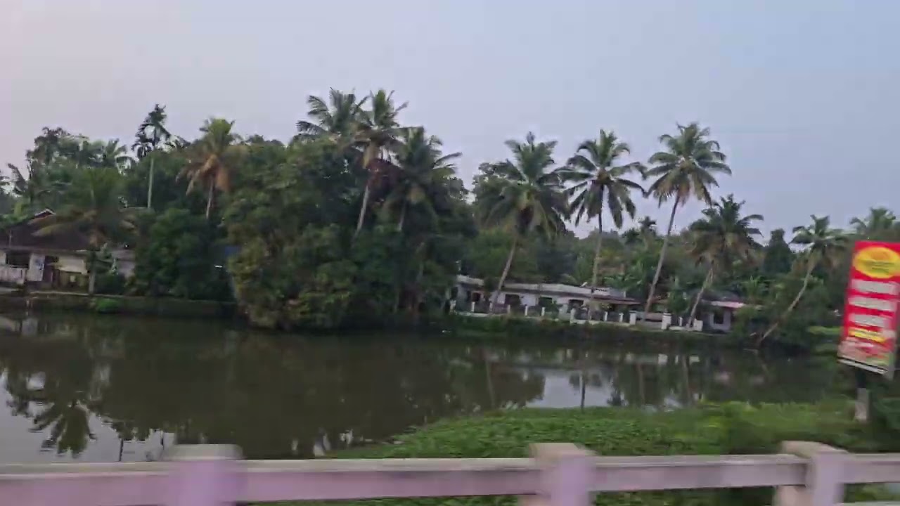 Bus window view of kerala water road....water transportation