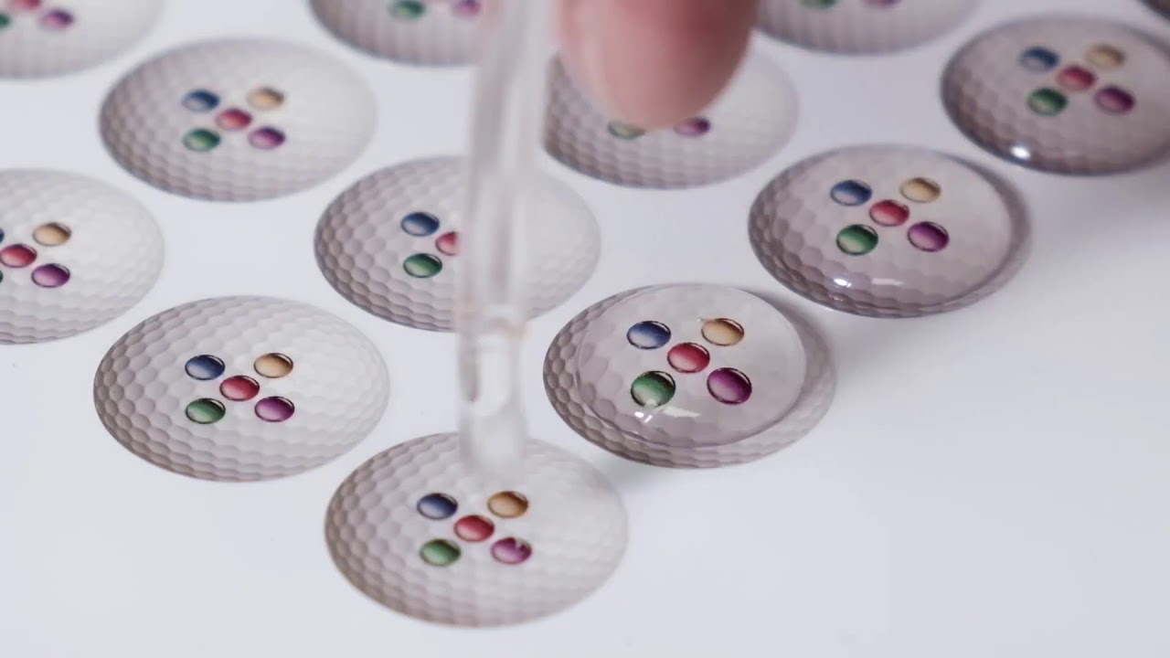 Liquid Lens label resin doming production system.