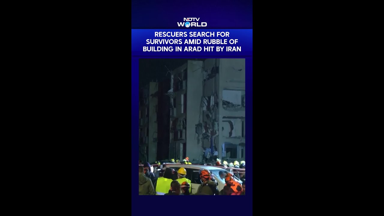 Rescue Workers Search For Survivors Amid Rubble Of Building In Arad Hit By Iranian Missile