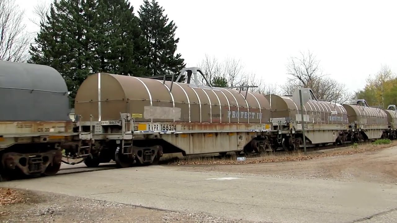 TONS OF PULPWOOD & COIL CARS ON THIS TRAIN NORTH BEFORE THE SNOW FALLS! | Jason Asselin