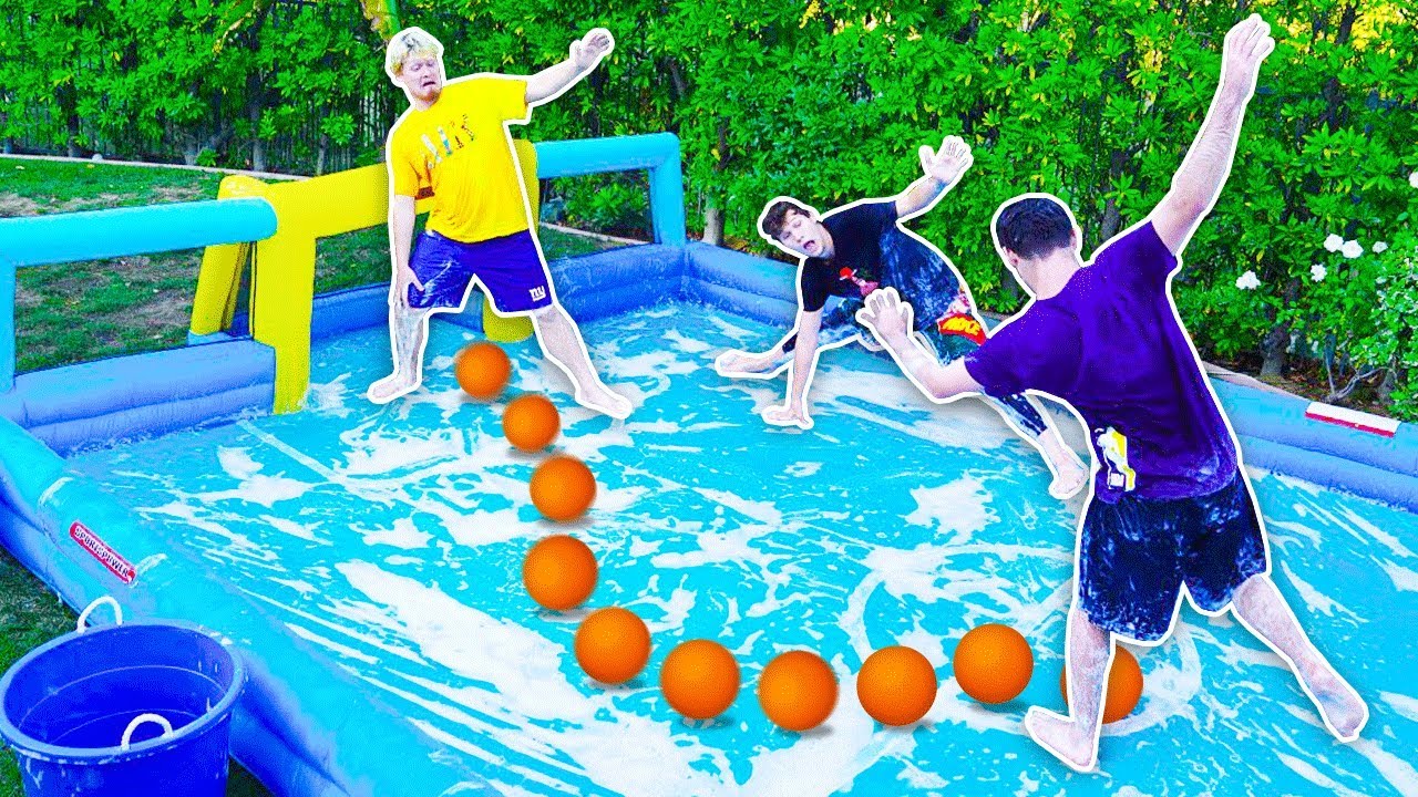 GIANT INFLATABLE  FOOTBALL SLIP AND SLIDE