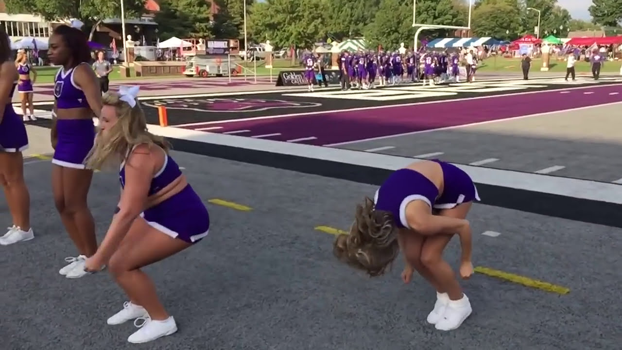 Slow mo back flip football game sideline