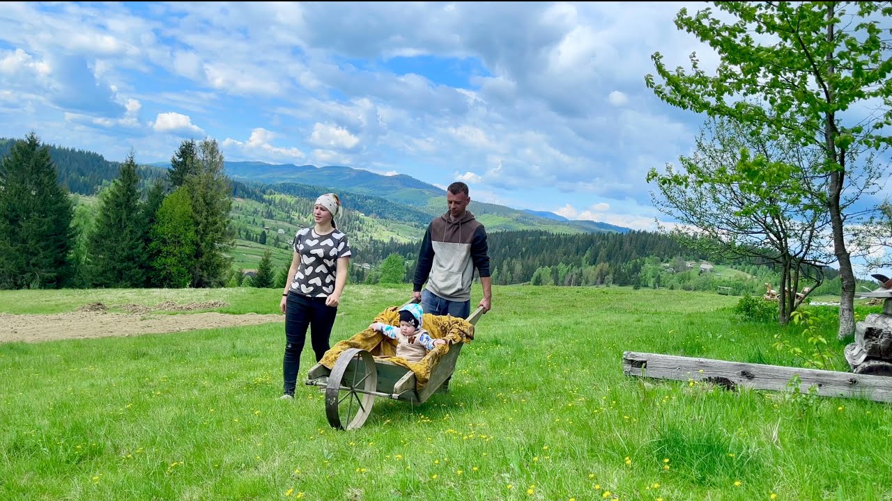 A simple happy life of a young family among the mountain peaks