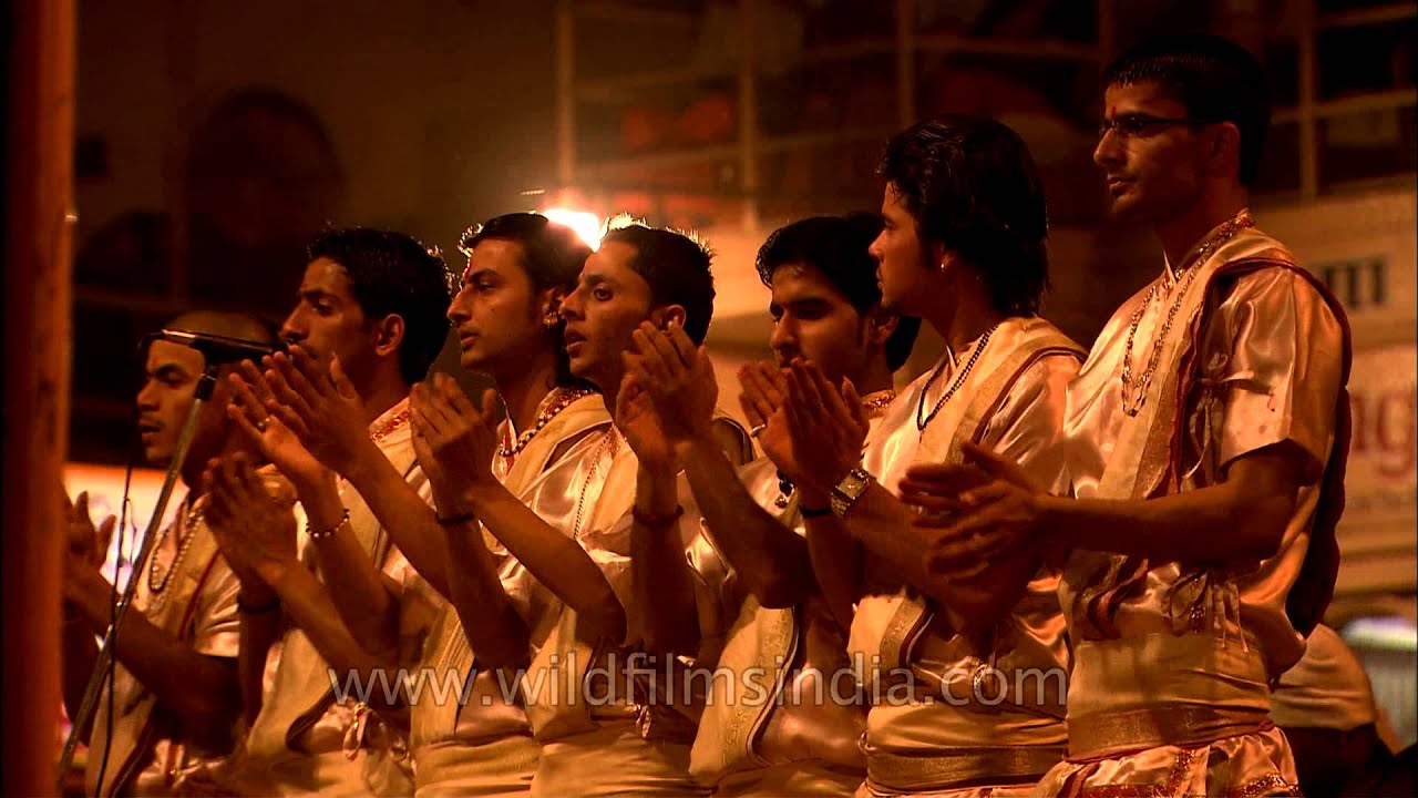 Priests singing devotional song at the Ghat of Varanasi