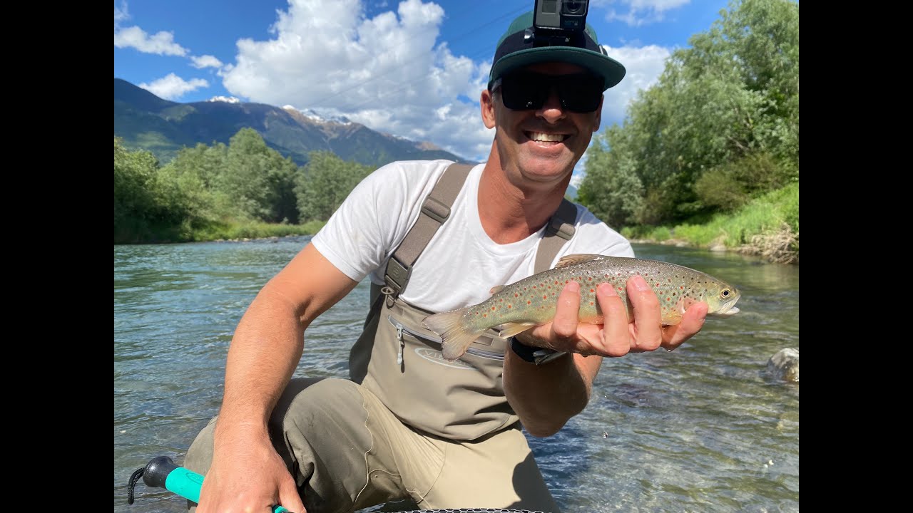 Fly Fishing and Spin Fishing for Trout In The River Adda Near Lake Como in Northern Italy
