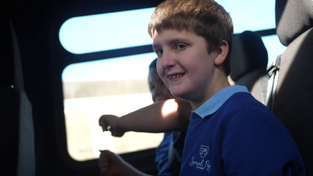 911 singer Jimmy Constable presents minibus to Samuel Pepys School