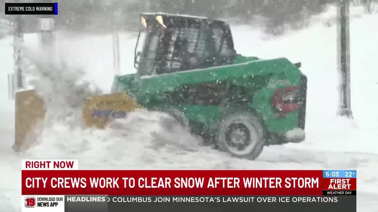 City crews work to clear snow after winter storm