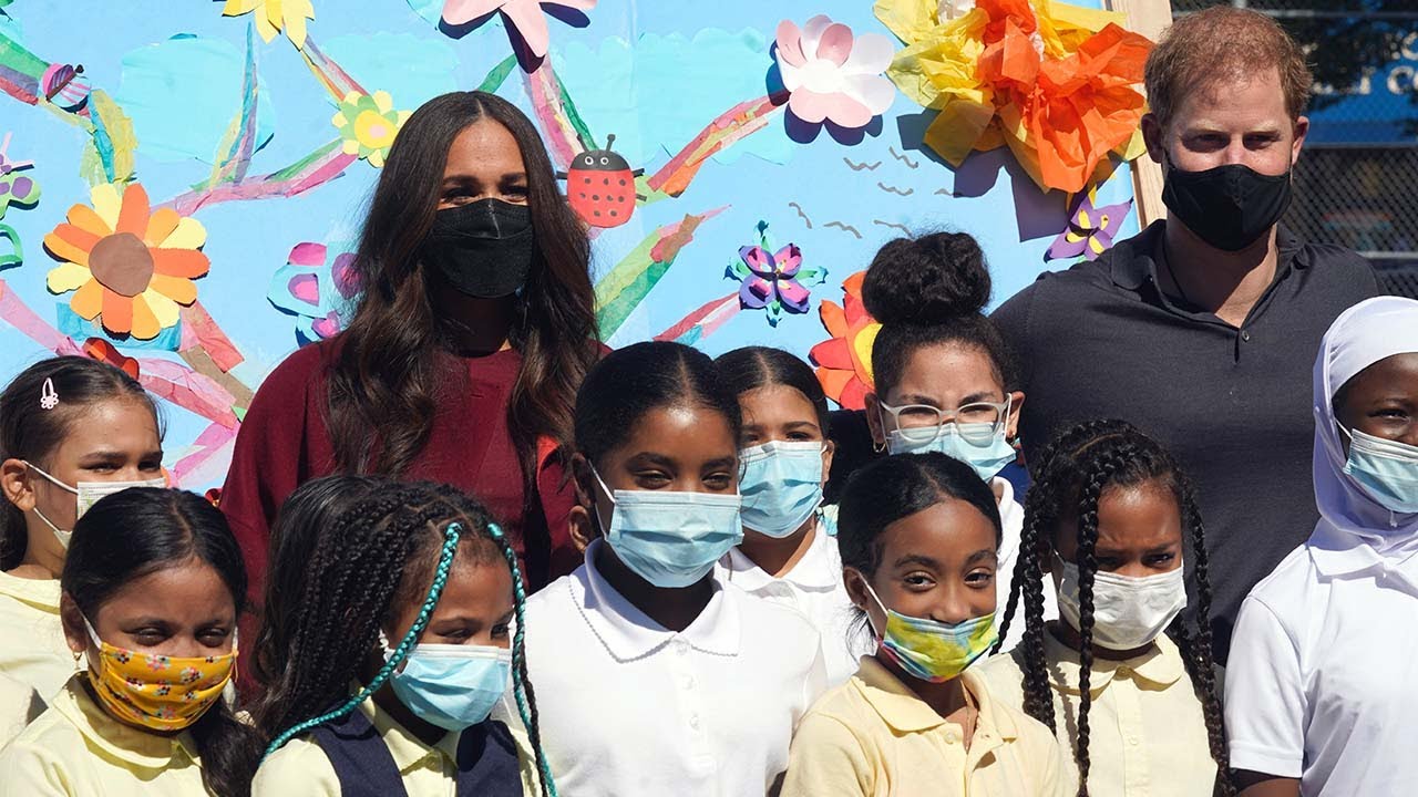 Prince Harry and Meghan Markle visit school children in Harlem