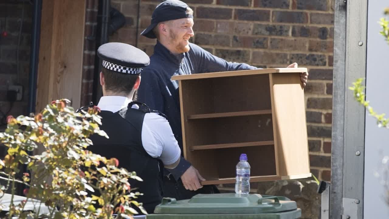 Forced from his home: Removal men load hero pensioner's belongings into the back of a