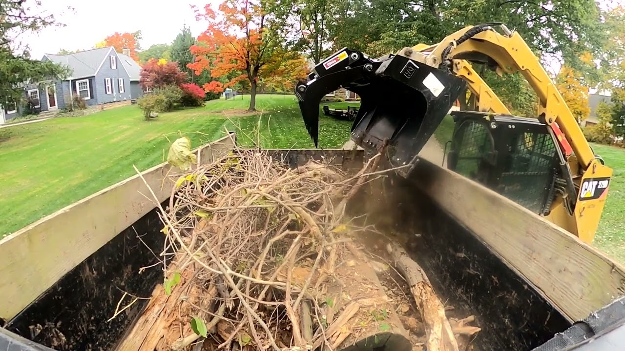 Clearing woods with a grapple bucket