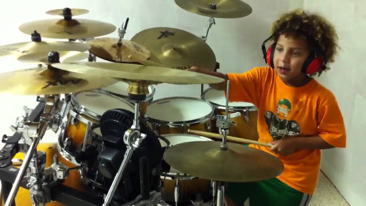 Mekhai playing drums
