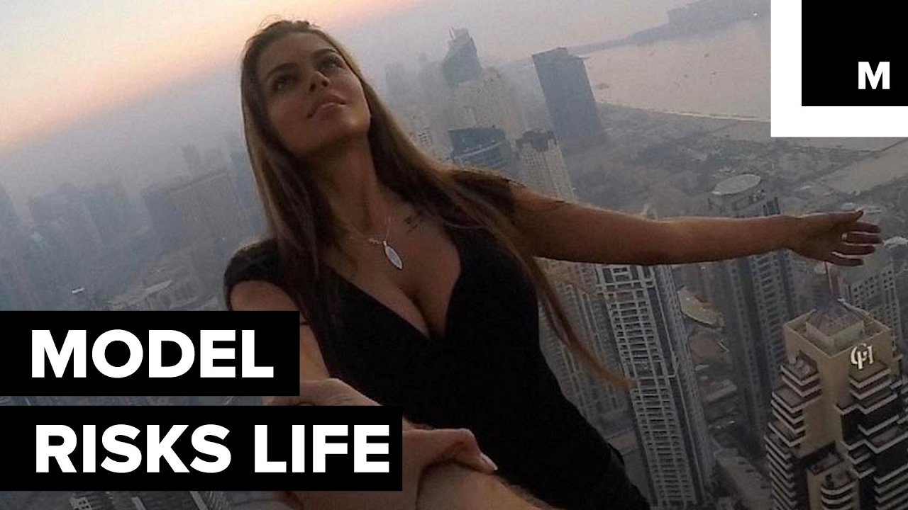 Model dangles from a Dubai skyscraper