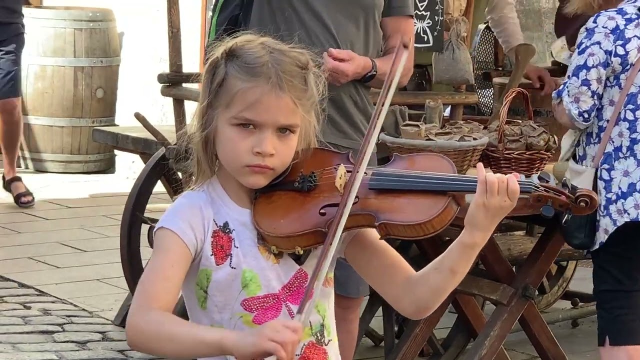 A Young Girl Plays A Violin In Tallinn Estonia