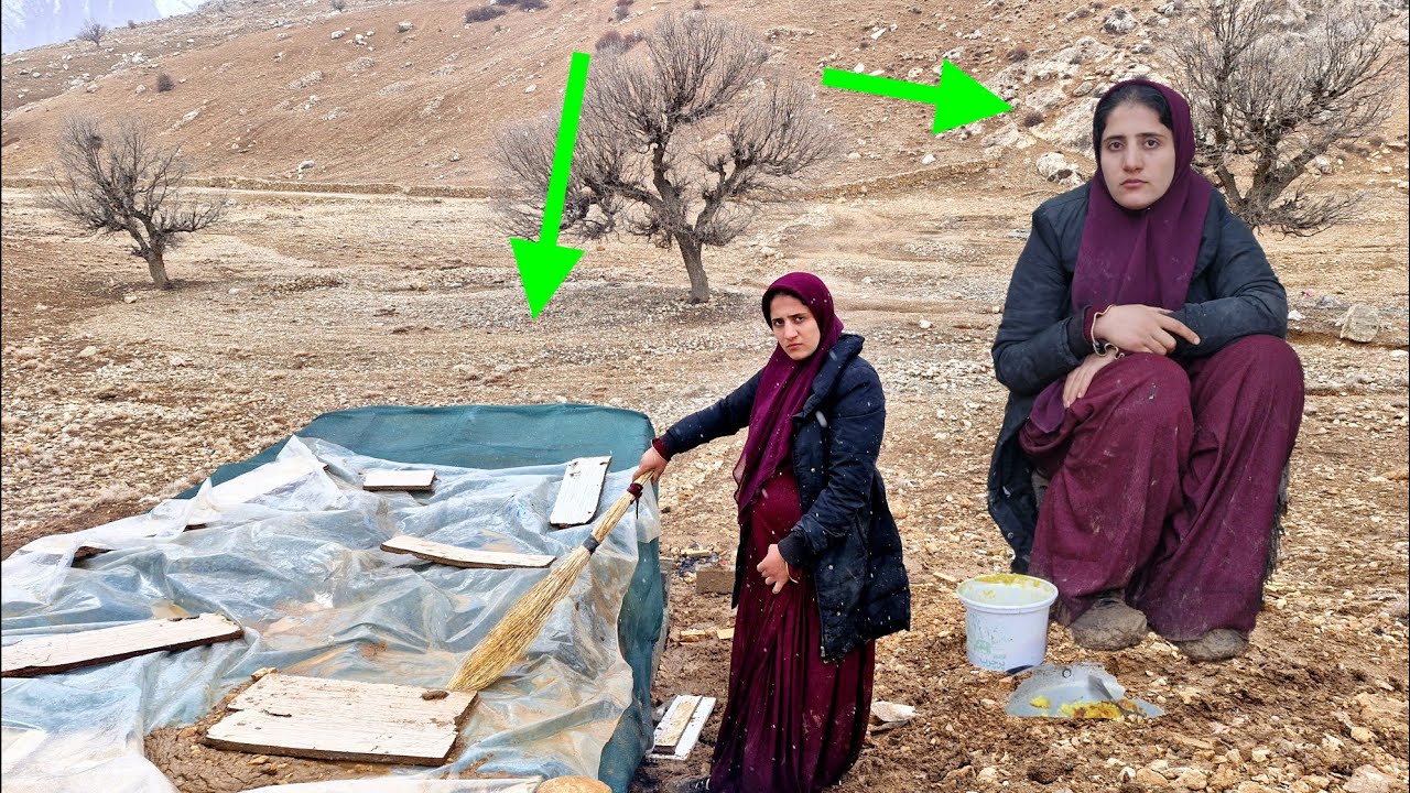 Homeless nomadic woman and her one-year-old son in a cave; Survival in the heart of snow and rain