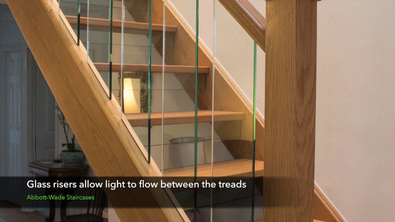 A new open tread oak staircase with glass spindles