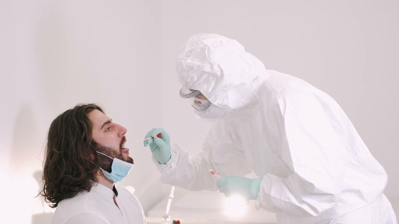 Covid 19 Stock Footage | Health Worker Doing Swab Test On A Man | 4K Royalty Free Stock Video