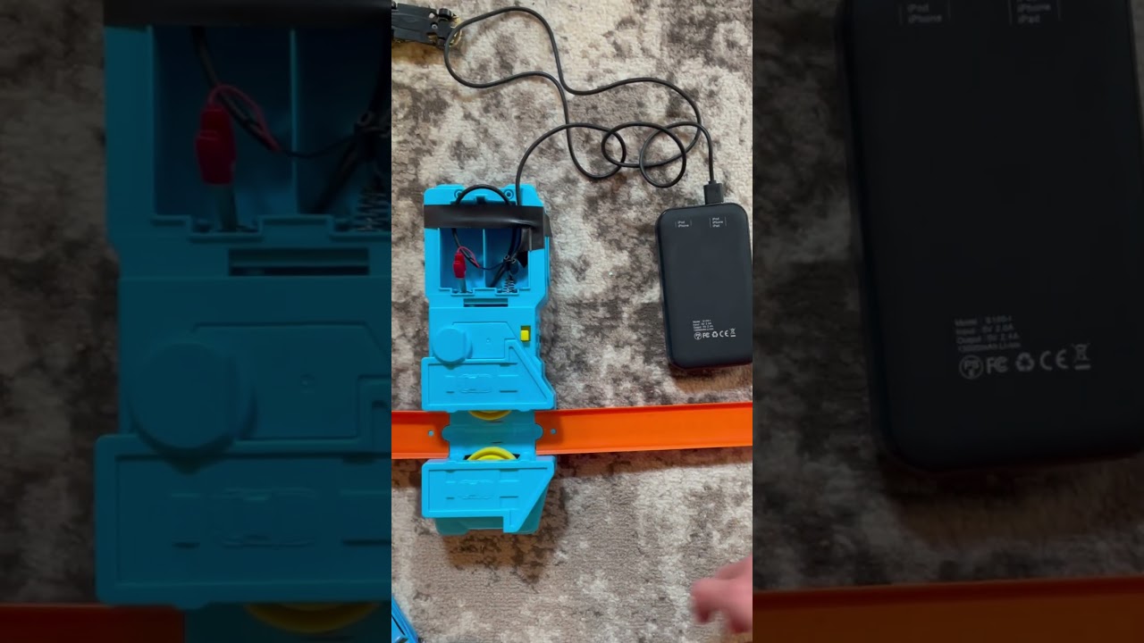 Power hotwheels booster with USB battery pack and alligator clips.