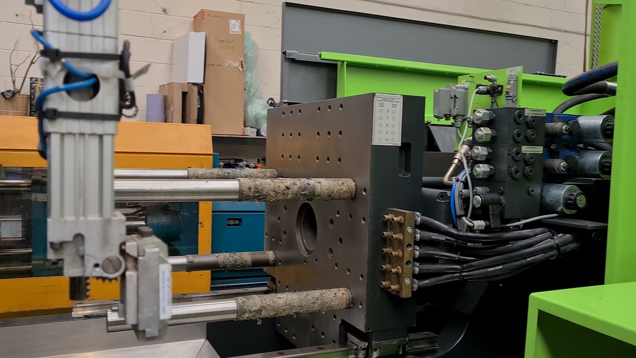 Engel 150 Tech refurbished by STV Machinery.  Viper robot and conveyor.