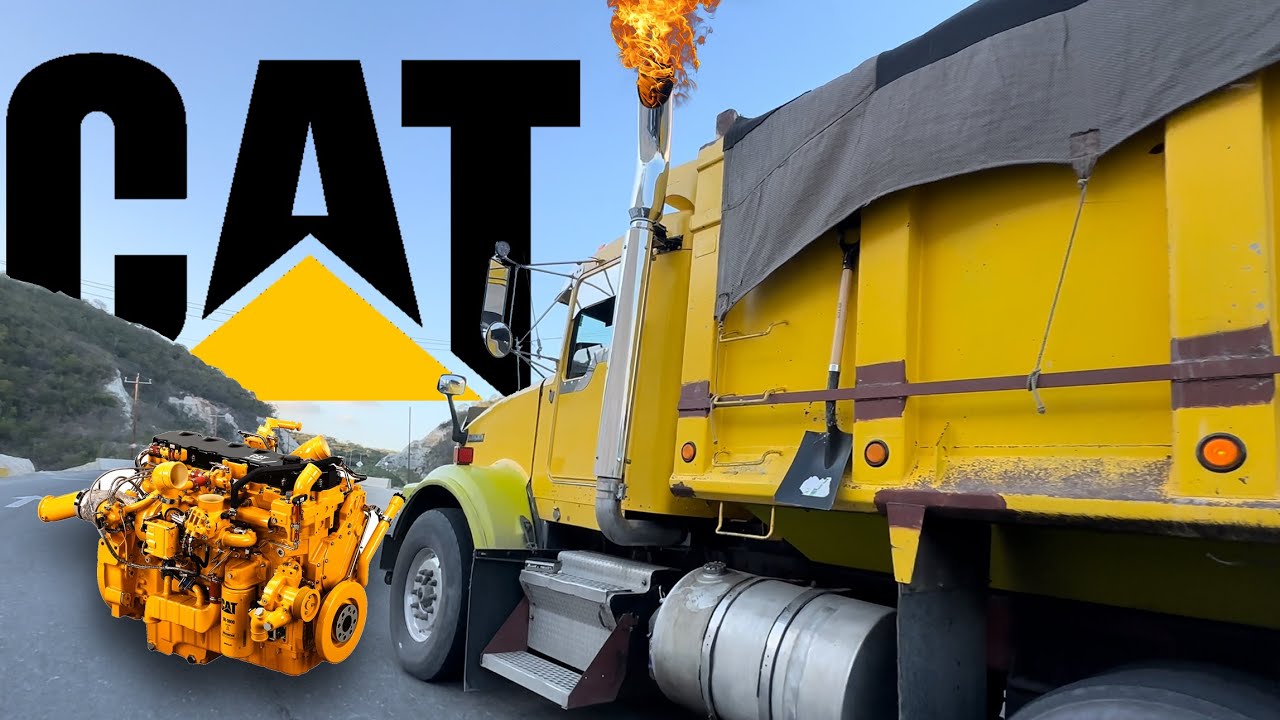 A C15 CAT engine roars up a steep grade, with a straight-pipe exhaust growling like a beast.