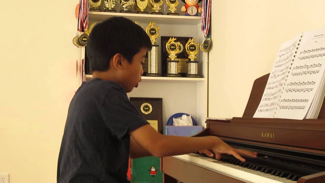 ~ Andrew plays piano and sings 