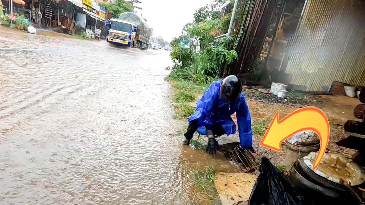 Draining Flooded Street With Stucking By Rubbish In Drain