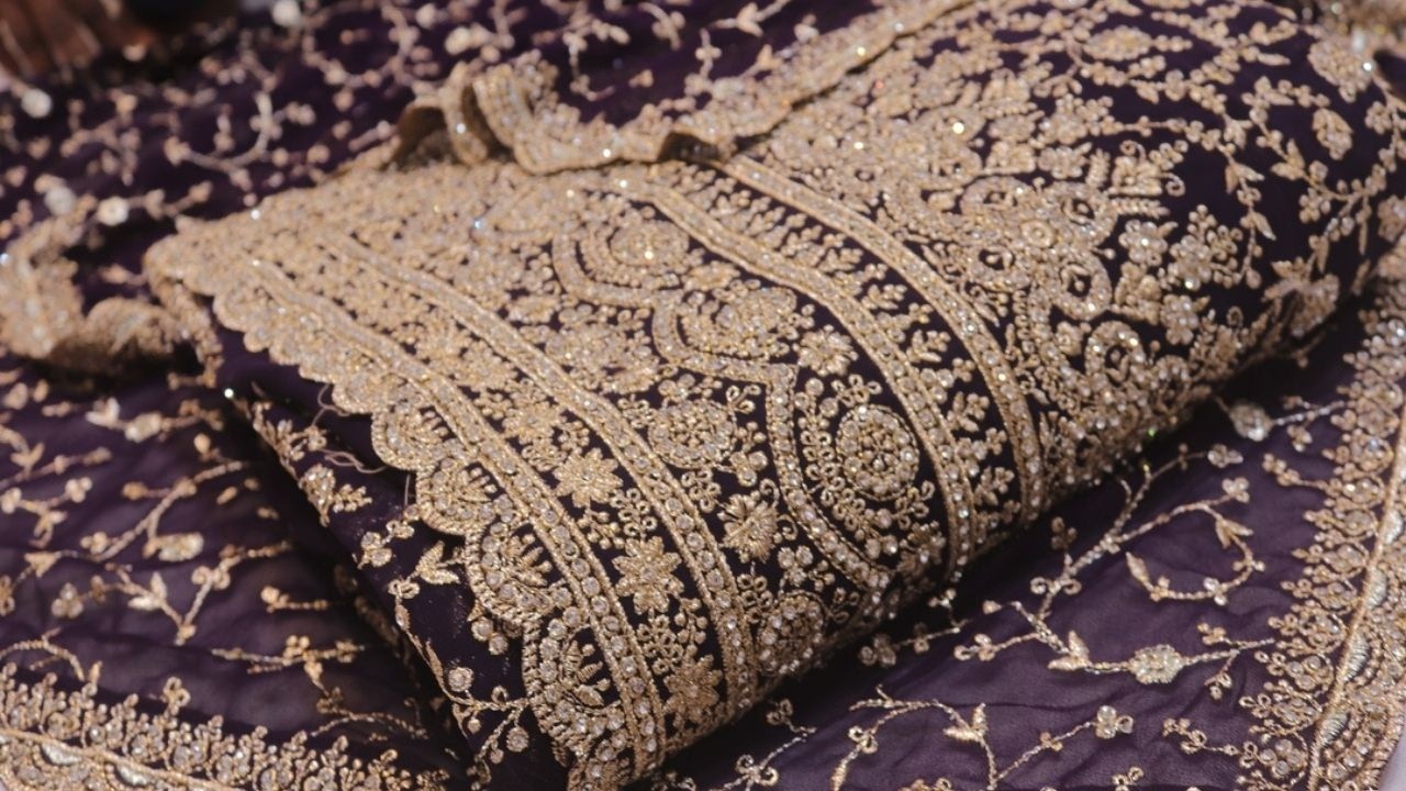 ARNG-4431 The Ultimate Reception Saree: Deep Plum Georgette with Intricate Gold Embroidery