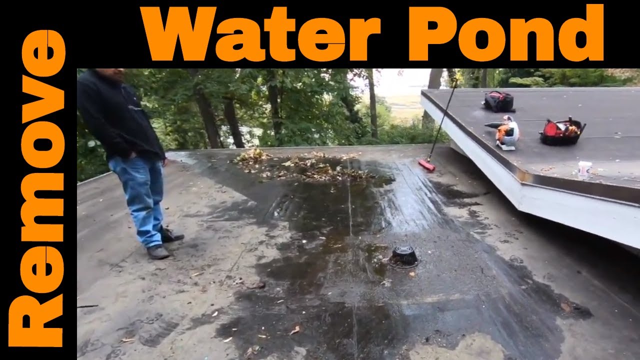 Remove ponding water off a flat roof - replace your roof drain with a channel and a scupper
