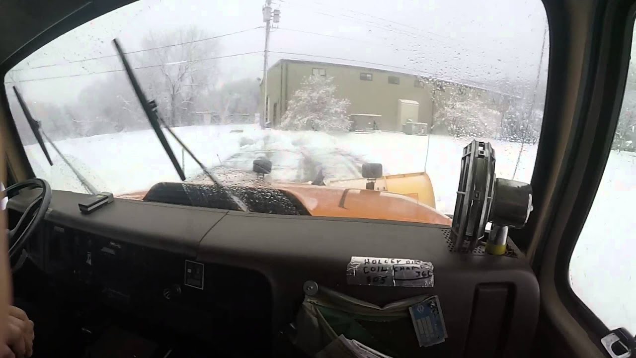 International plow truck pushing snow
