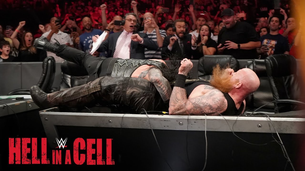 Roman Reigns Spears Erick Rowan through the announce table: WWE Hell in a Cell 2019