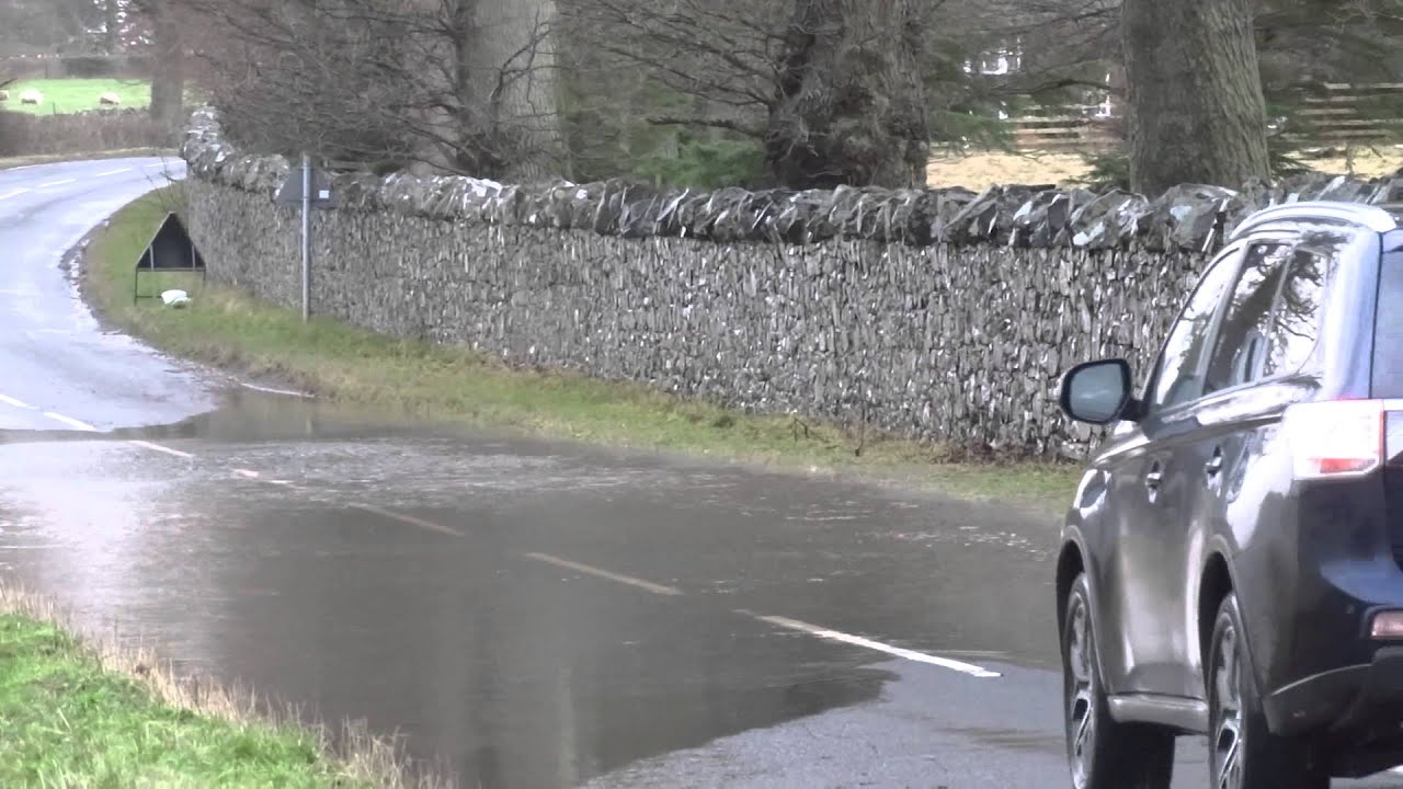 Cars Driving On Storm Frank Flooded Roads Perthshire Scotland