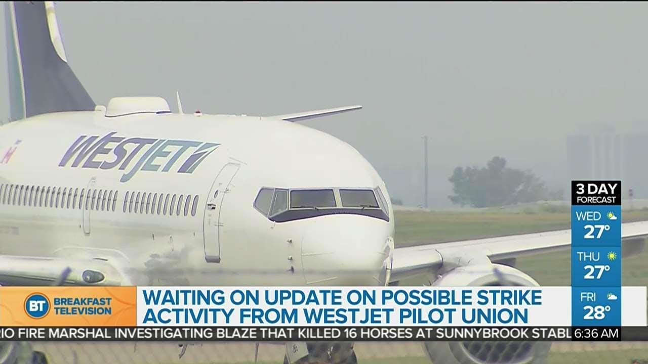 Passengers wait for updates on a possible WestJet pilot strike