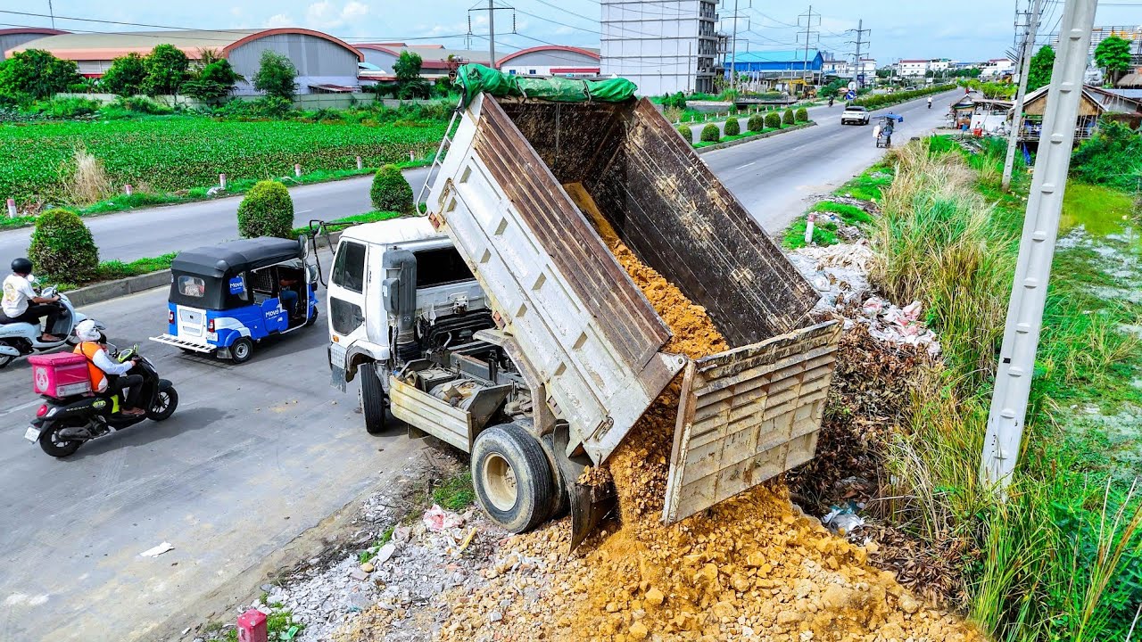 Just Start new project LandFill up process by Dump truck unloading soil & Dozer Push soil clear land