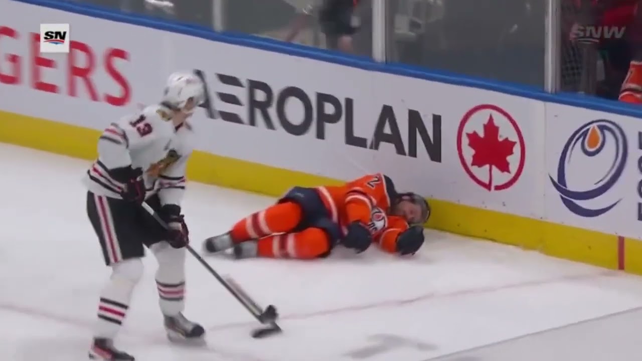 Keith gets knocked unconscious after slamming into the boards