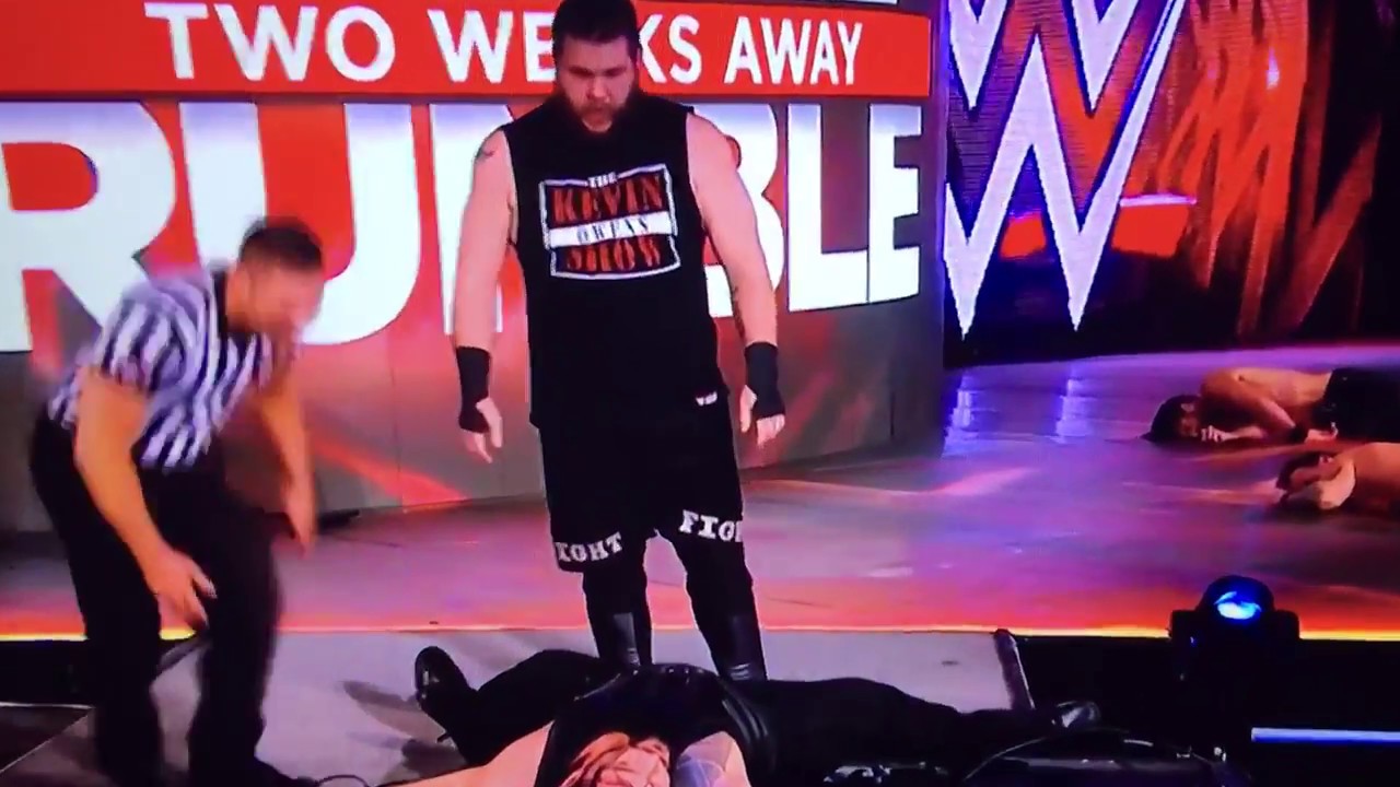 Kevin Owens Powerbombs Roman Reigns through Table WWE RAW 1/16/2017