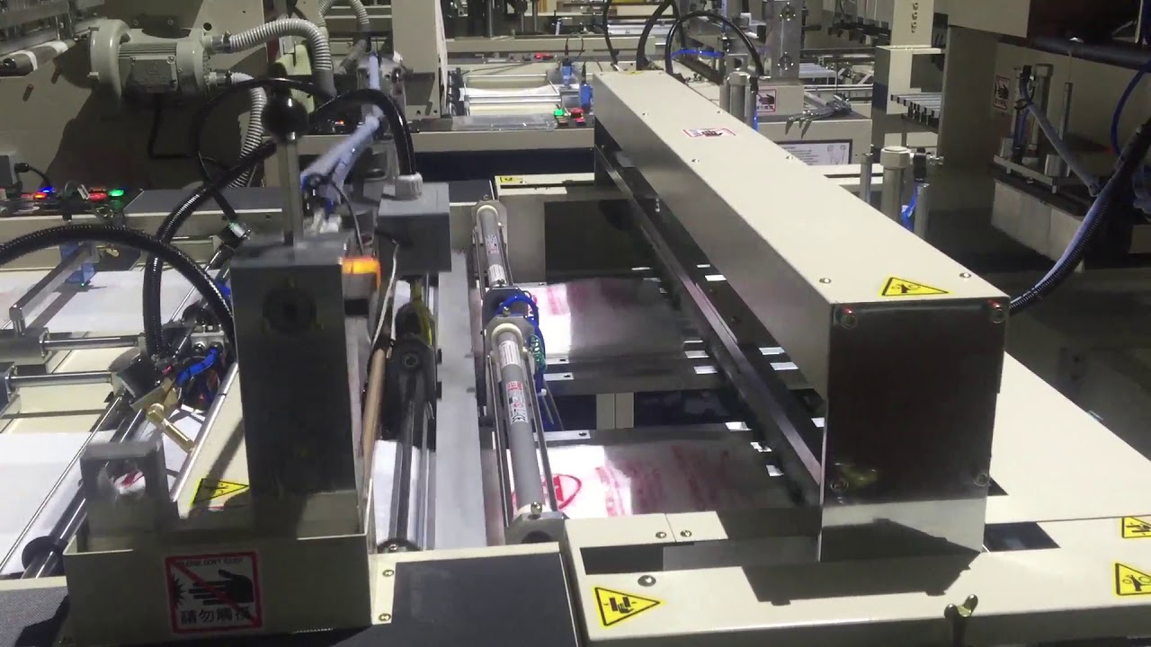 SERVO MOTOR CONTROLLED FULLY AUTOMAYIC 2 LINES T-SHIRT BAG MAKING MACHINE (ST-77) - COSMO MACHINERY