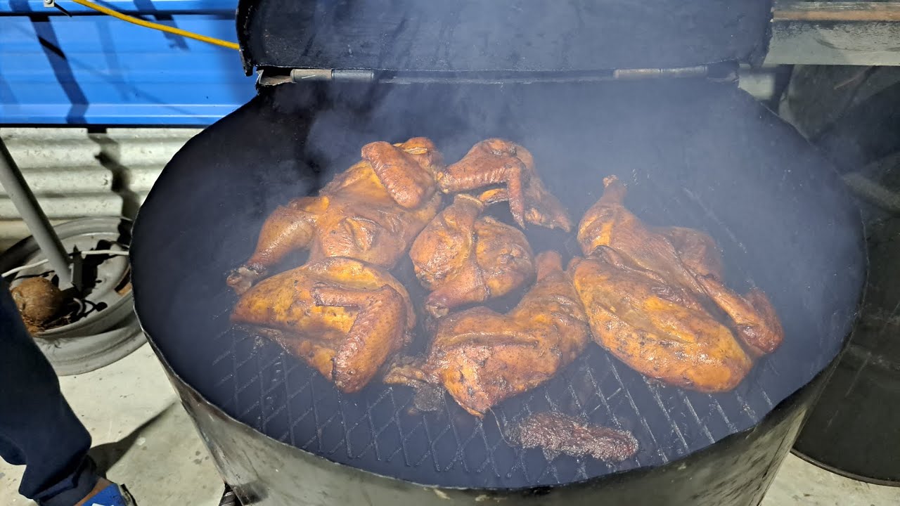 Trini backyard lime....Chef Buju is making smoked chicken and pork in his homemade smoker!