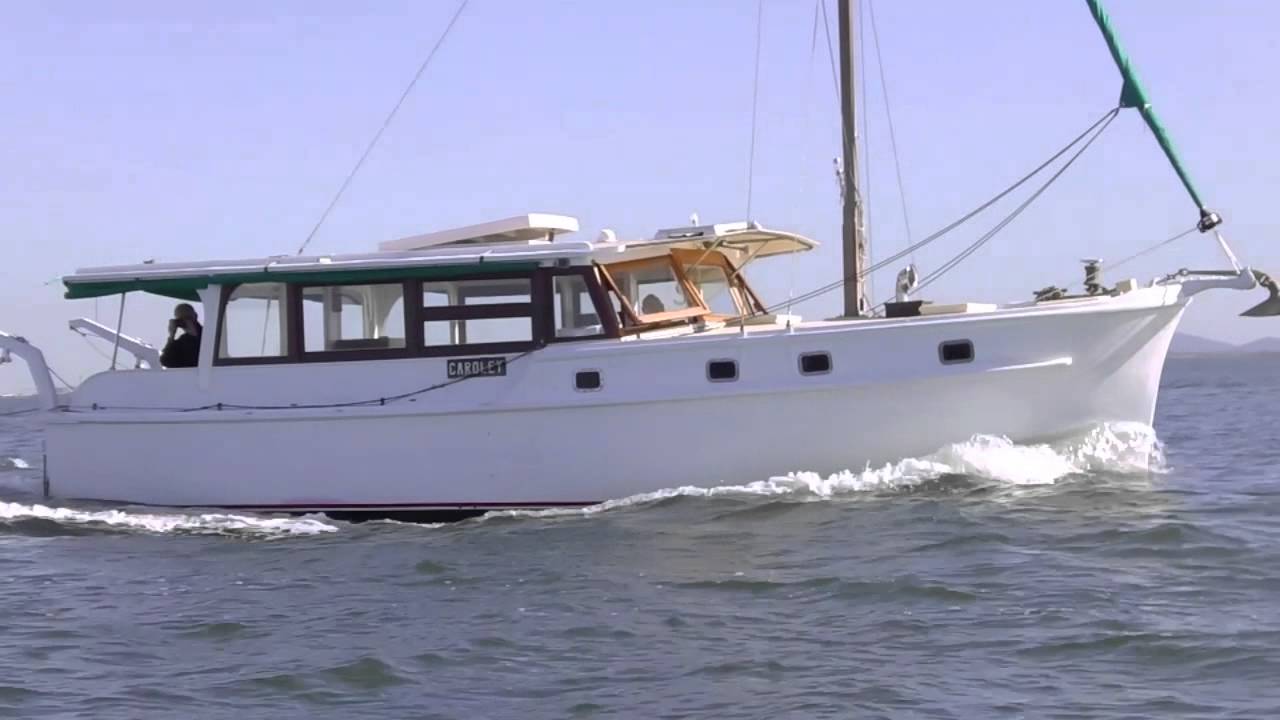 Classic Moreton Bay Cruiser Caroley and wooden tender Happy