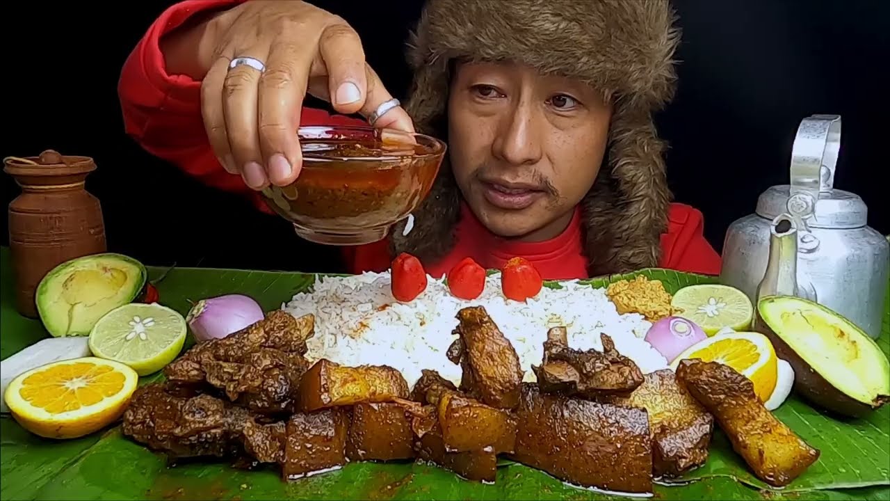 EATING PORK WITH LOTS RICE AND NEPALI DALLE CHILLY