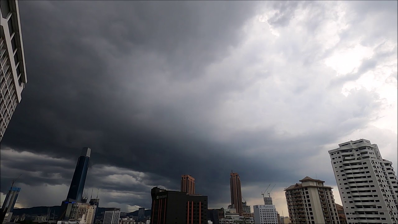 Heavy clouds, rain and lighting sweep through Kuala Lumpur, time lapse