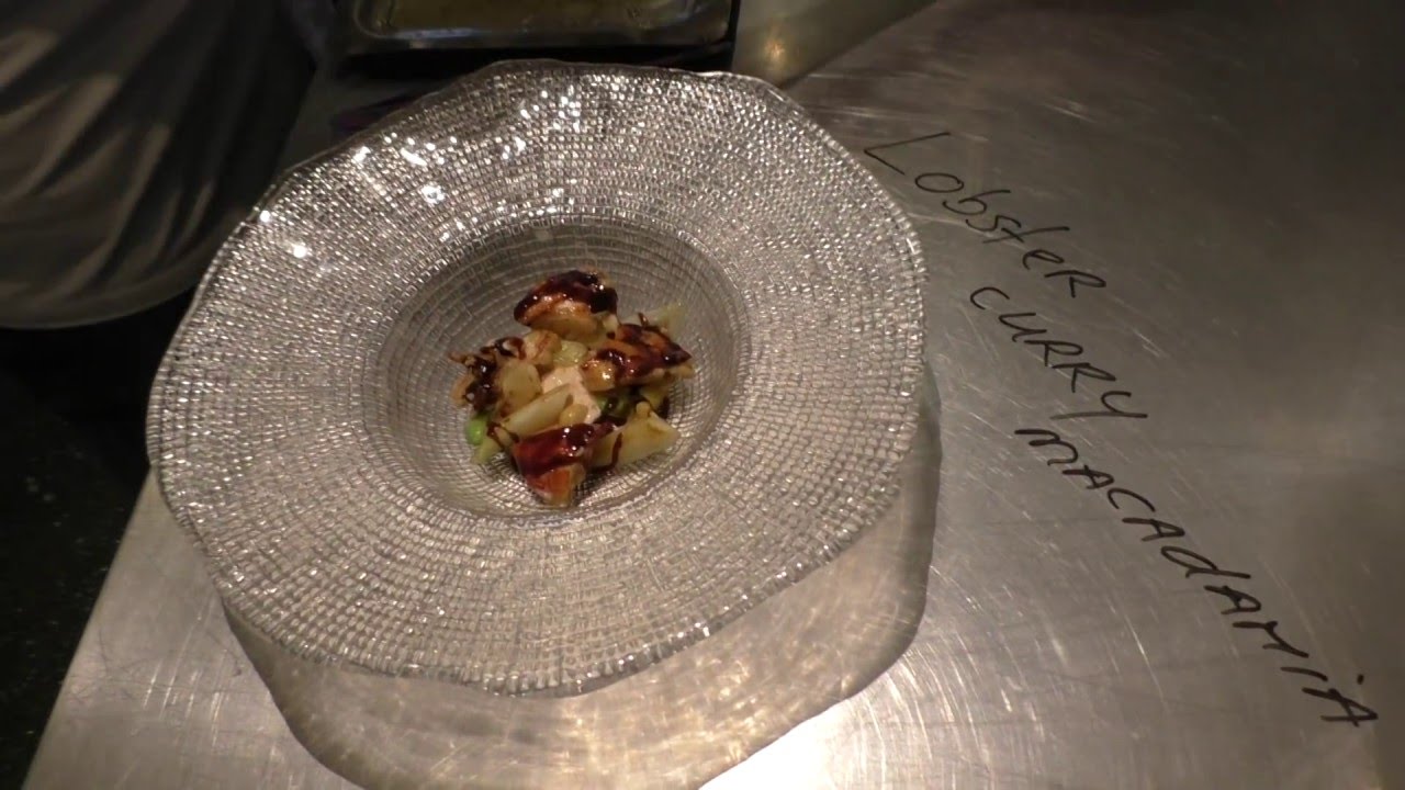 Stefan van Sprang prepares a signature dish with lobster at the Michelin star Aan De Poel